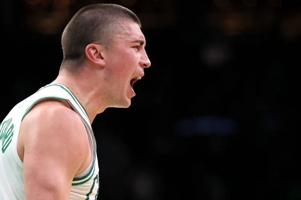Payton Pritchard of the Boston Celtics celebrates after scoring against the Portland Trail Blazers during the second quarter at TD Garden on March...