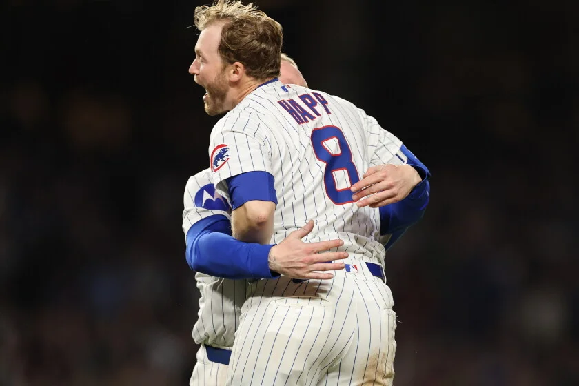 Ian Happ celebrating with Cubs teammate after victory