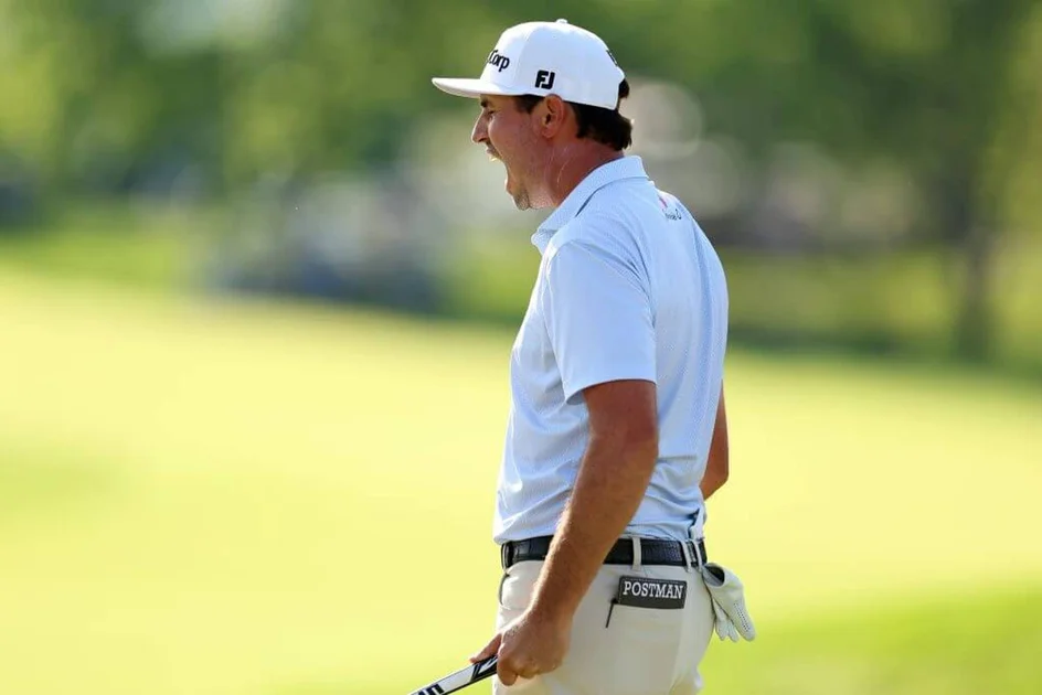 J.T. Poston yells after his winning putt on the 18th green at the Memorial Tournament in Dublin, Ohio.