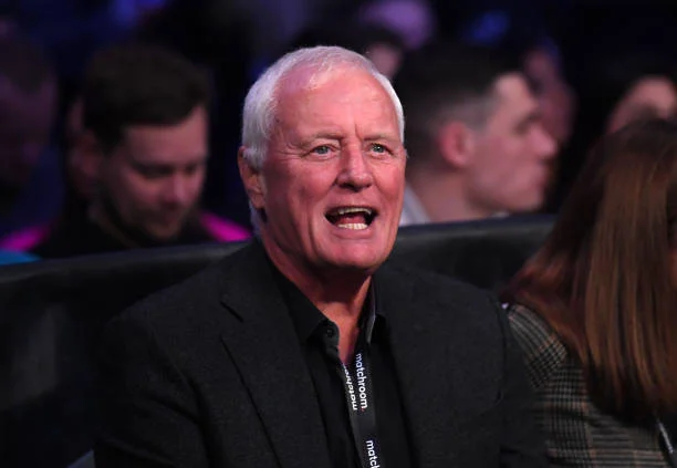 Barry Hearn reacts prior to the super-middleweight fight between Daniel Jacobs and John Ryder at Alexandra Palace on February 12, 2022 in London,...