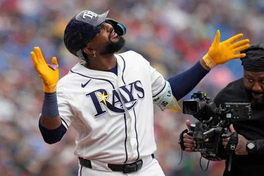 Junior Caminero, the young slugging star of the Tampa Bay Rays, spent a recent and rare day off visiting with Tampa-area youngsters. (Chris O'Meara/AP Photo)