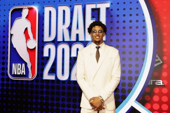 Yaxel Lendeborg arrives for the first round of the NBA basketball draft Tuesday, June 23, 2026, in New York. (AP Photo/Adam Hunger)