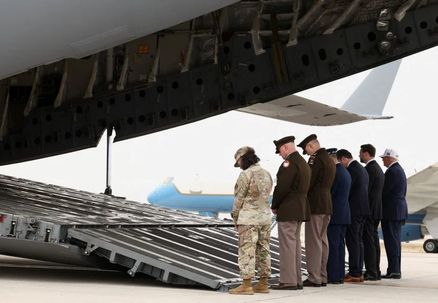 President Donald Trump and other officials attend a dignified transfer in Dover, Delaware, on March 7.