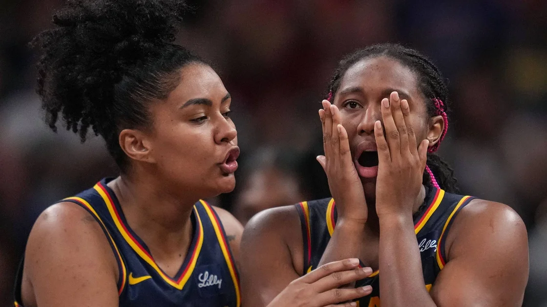 Indiana Fever forward Aliyah Boston (7) and Damiris Dantas (12) react during a game.