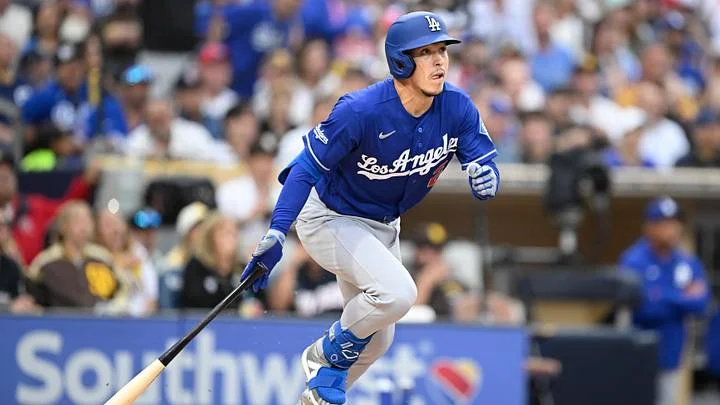 Jun 27, 2026; San Diego, California, USA; Los Angeles Dodgers second baseman Tommy Edman (25) hits an RBI triple during the sixth inning against the San Diego Padres at Petco Park. Mandatory Credit: Denis Poroy-Imagn Images