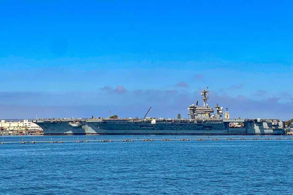 Portside view of U.S. Navy aircraft carrier 70 docked in Coronado, San Diego County, California, USA.