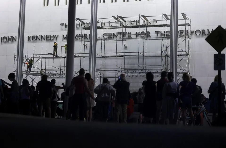 PHOTO: Lettering referencing U.S. President Donald Trump is removed from the facade of the John F. Kennedy Center for the Performing Arts, in Washington