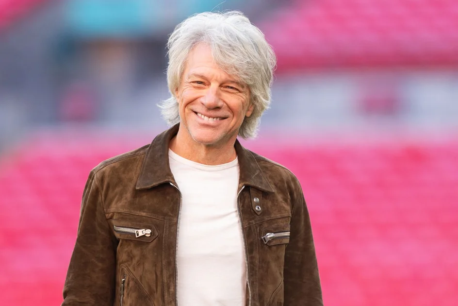 Jon Bon Jovi poses on the Wembley pitch during a special announcement of the "Forever Tour" at Wembley Stadium on October 24, 2025