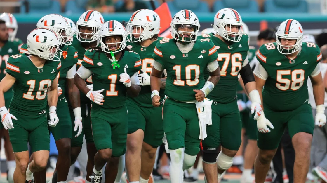 Miami Hurricanes quarterback Darian Mensah (10) leads the offense onto the field against the Central Michigan Chippewas during the first quarter at Hard Rock Stadium.